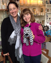 Mother and daughter with black and white checked Red Rufus SockDog