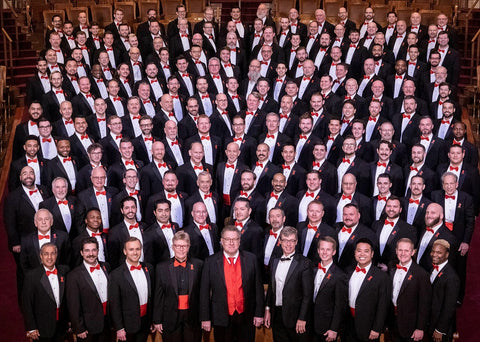 Boston Gay Mens Chorus performs A Super Gay Christmas in red bow ties & cummerbunds from Tuxedo Closeouts.