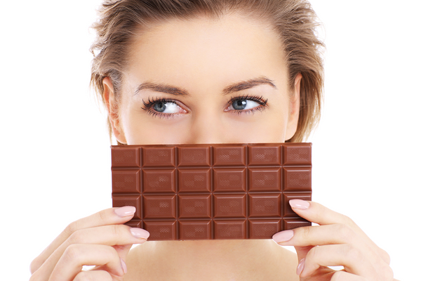 Woman Holding Chocolate Bar - www.chocolateandmoredelights.com