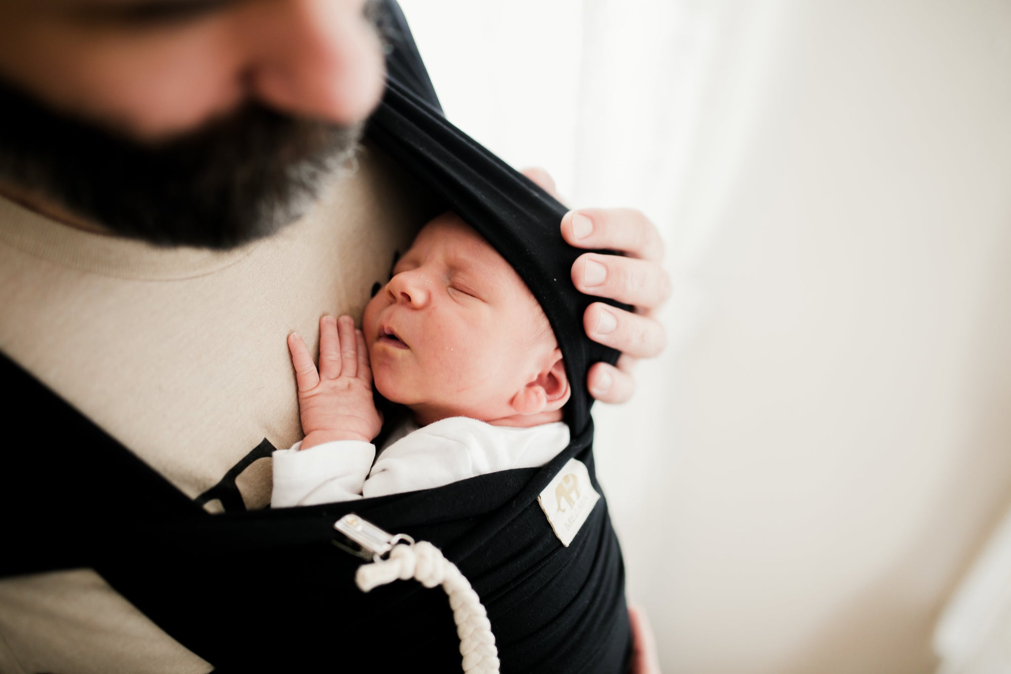 Sleeping baby in wrap carrier 