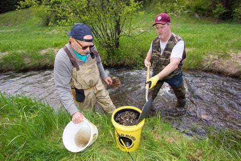 Two men panning with a Gold Rush Nugget Bucket