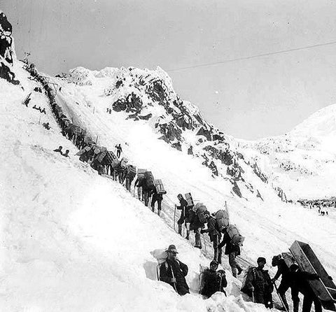 Climbers ascending the Chilkoot Pass near Klondike.