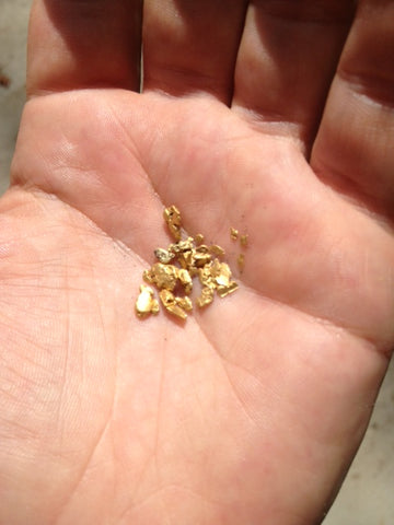 Gold nuggets in a hand