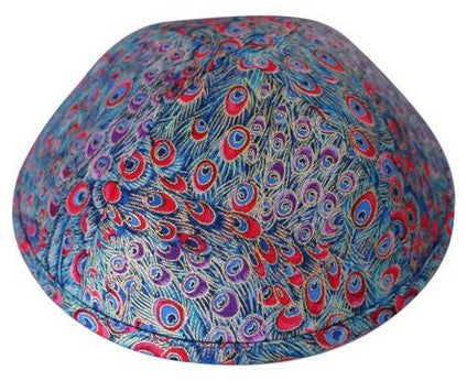 A beautiful iKIPPAH brand yarmulke the looks like the color and texture of an exotic peacock.