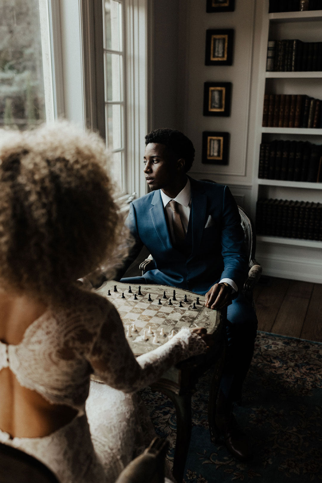 Groom in suit playing chess