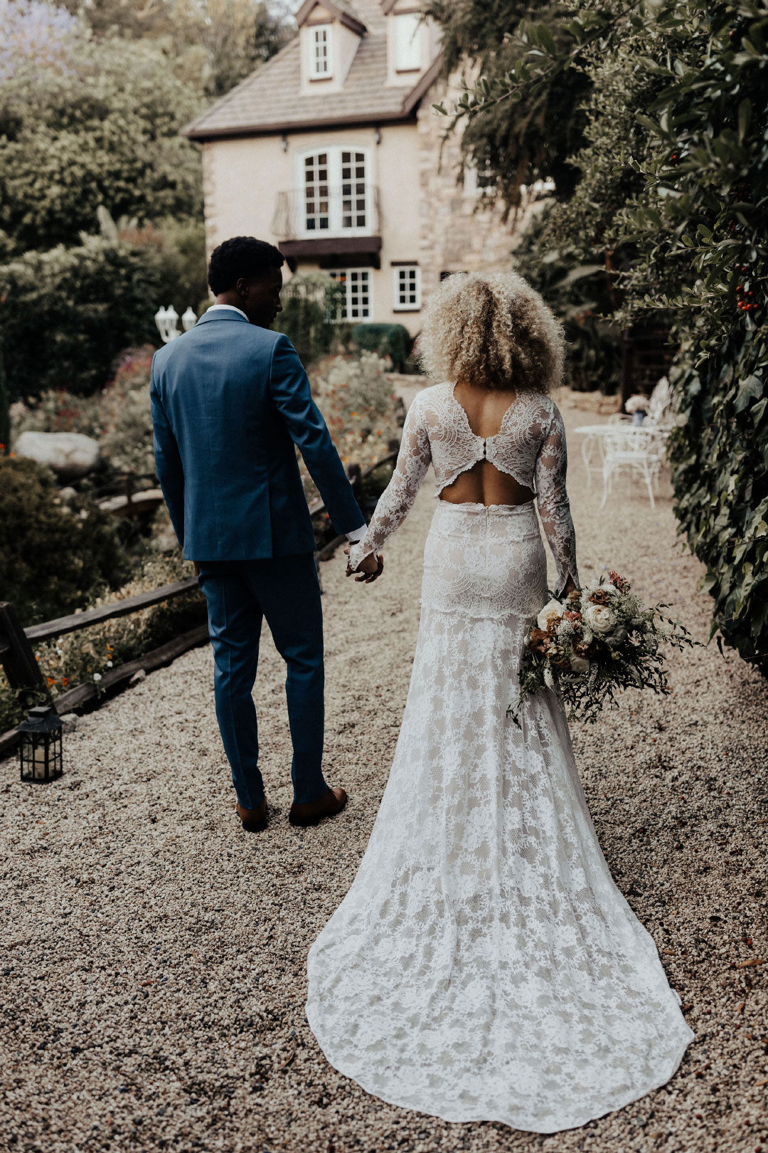 Wedding Inspiration photo Bride and Groom back shot lace train 