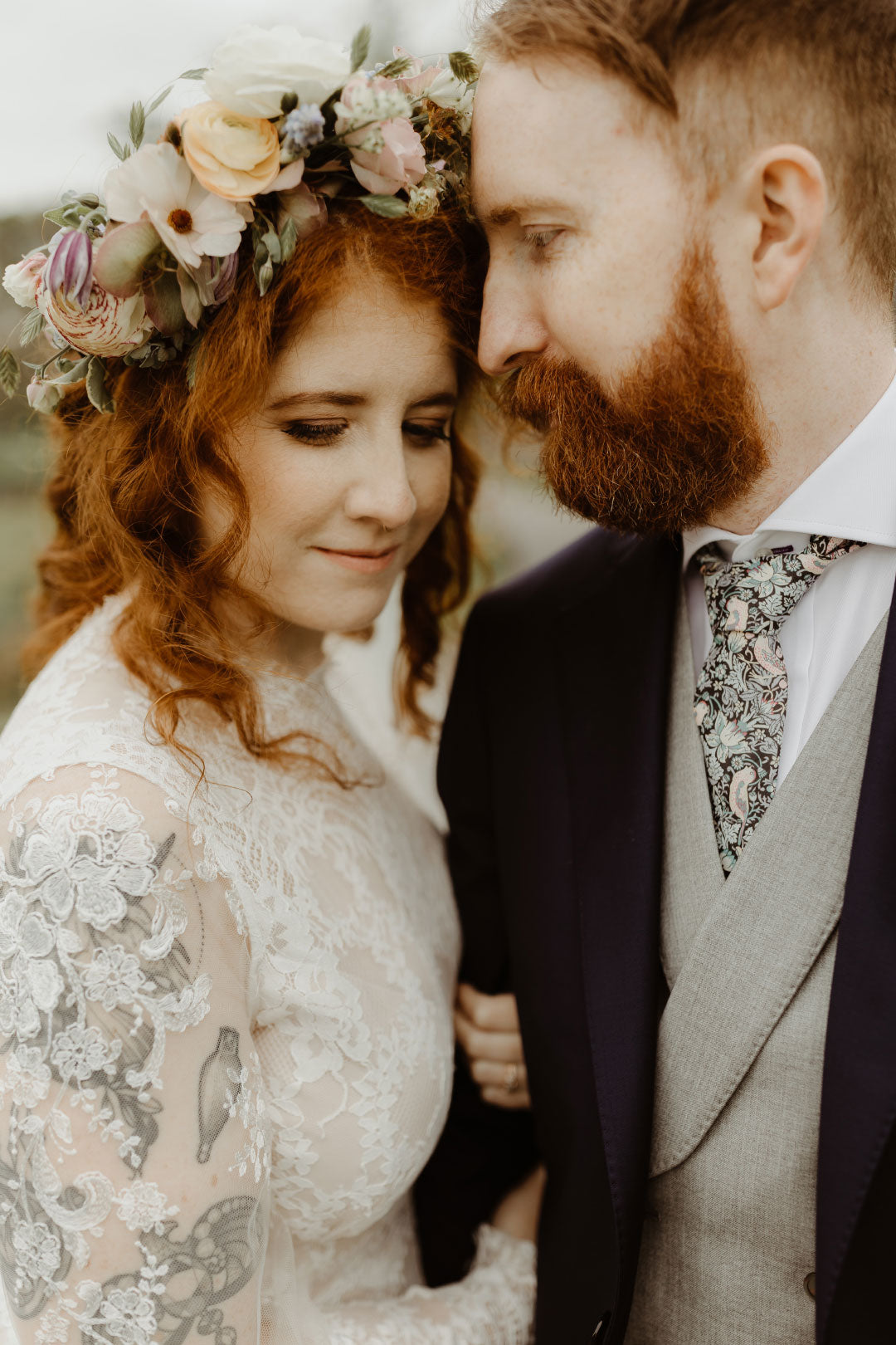 Bride and Groom posing for photo Bride with Floral Crown