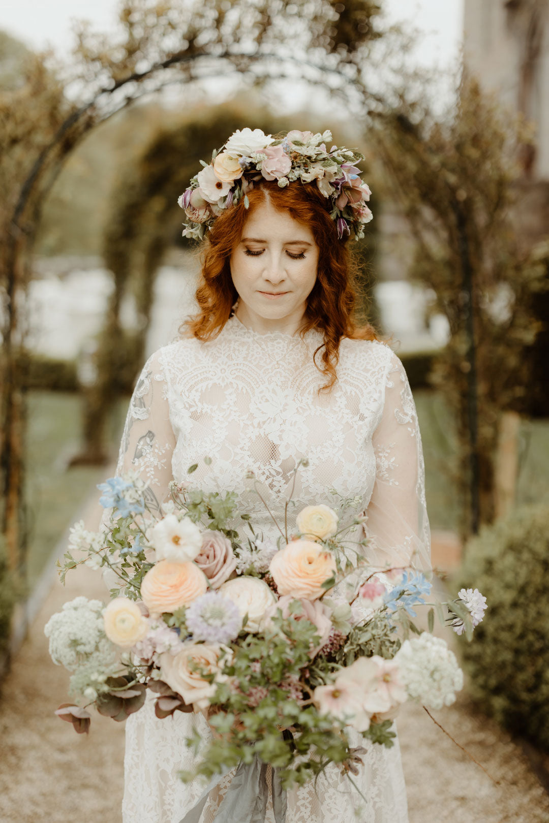 Bride with Floral crown holding wedding bouquet