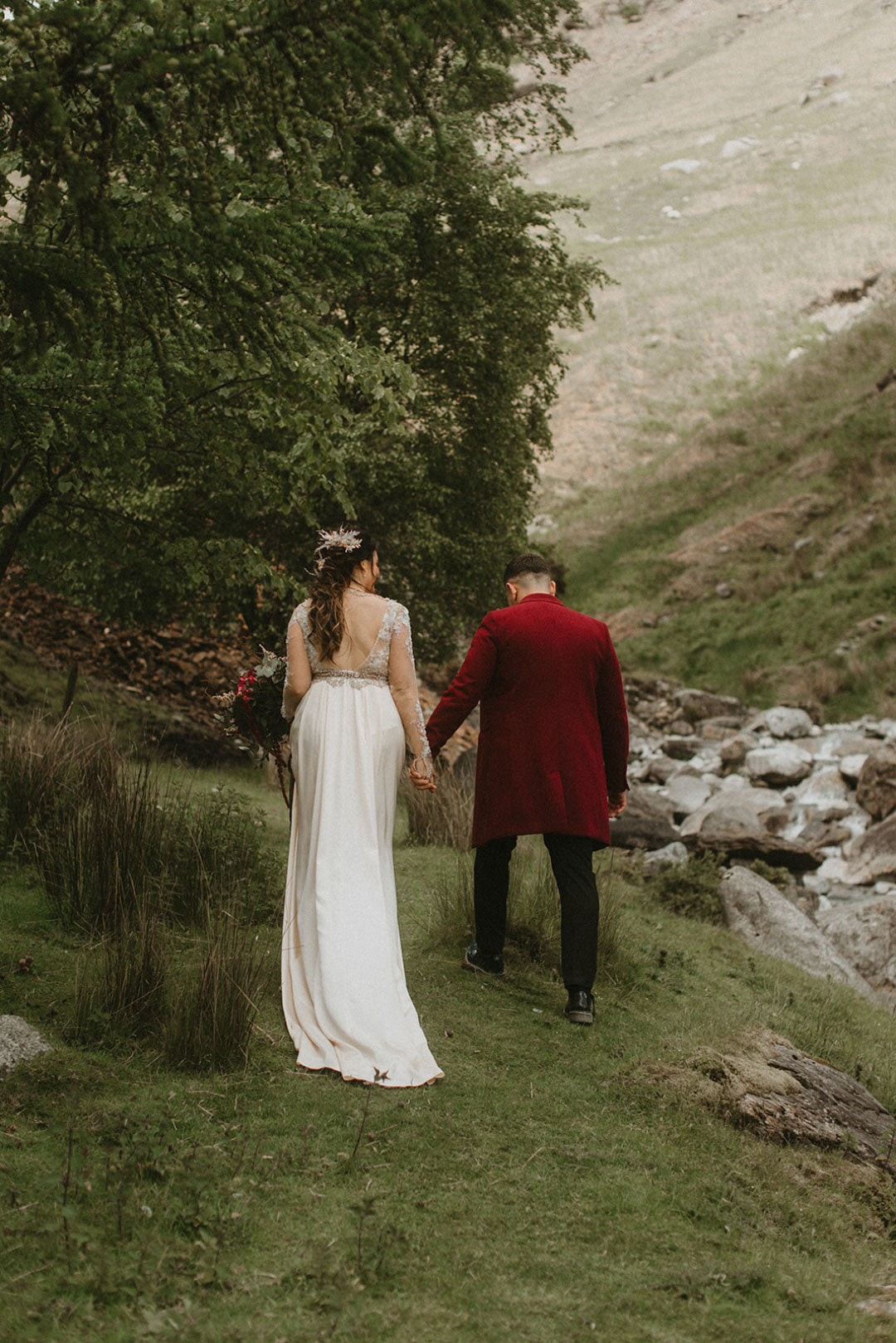 Bride and Groom walking in country landscape