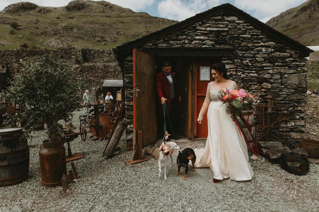 Bride and groom leaving stone shack