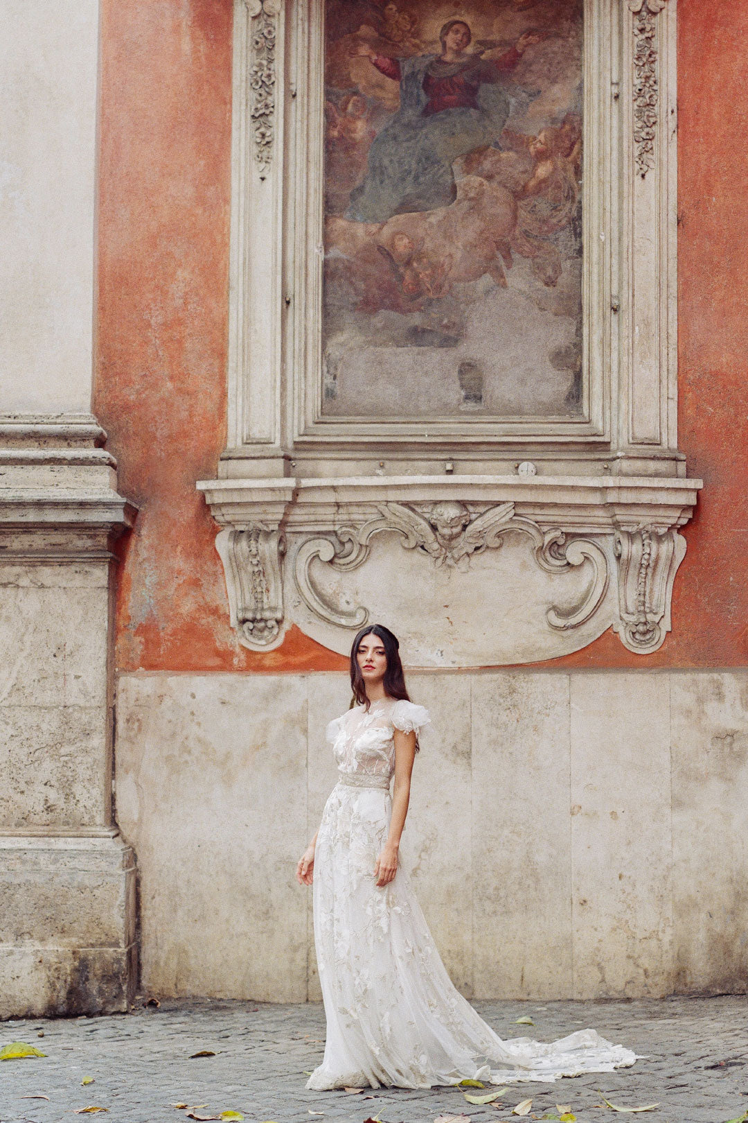 Bride in Wedding dress view Renaisance frescoe in Italy