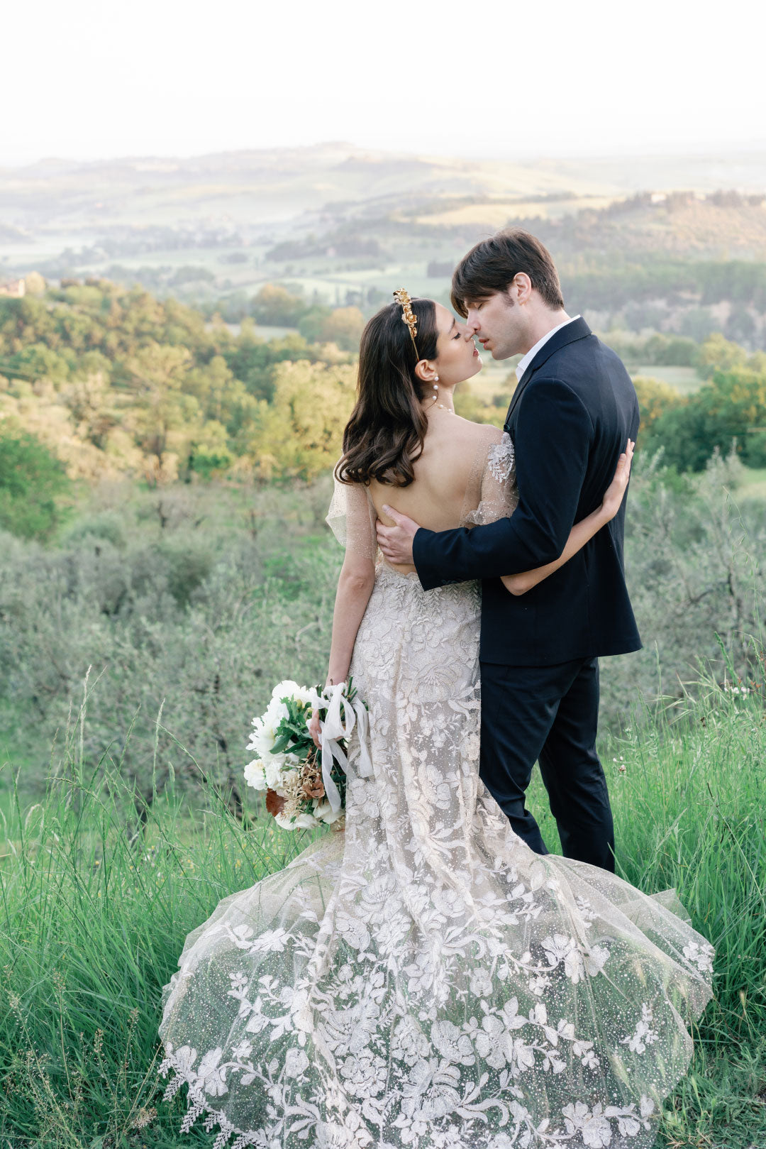 Bride and Groom Kiss Villa Vista in Background 
