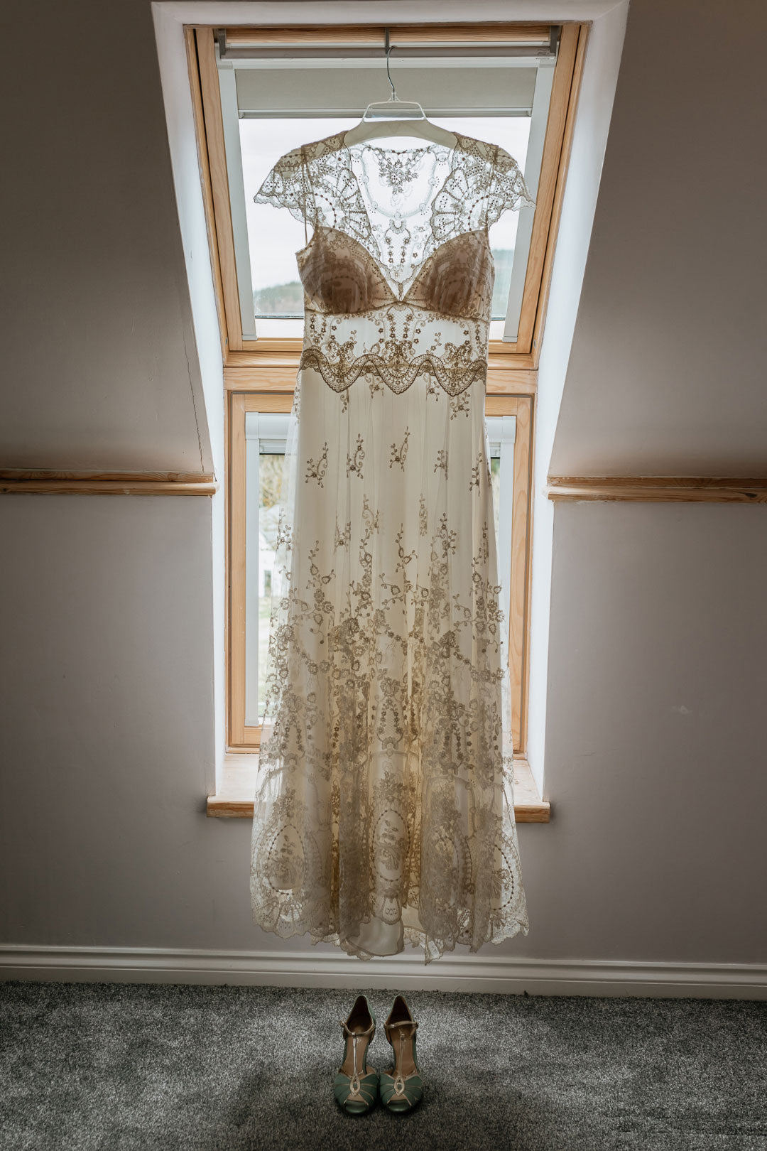 Cora lace and embroidered wedding dress on hanger