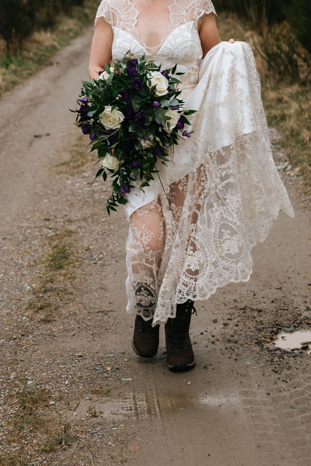 Lace skirt detail of the Cora wedding dress bride in hiking boots