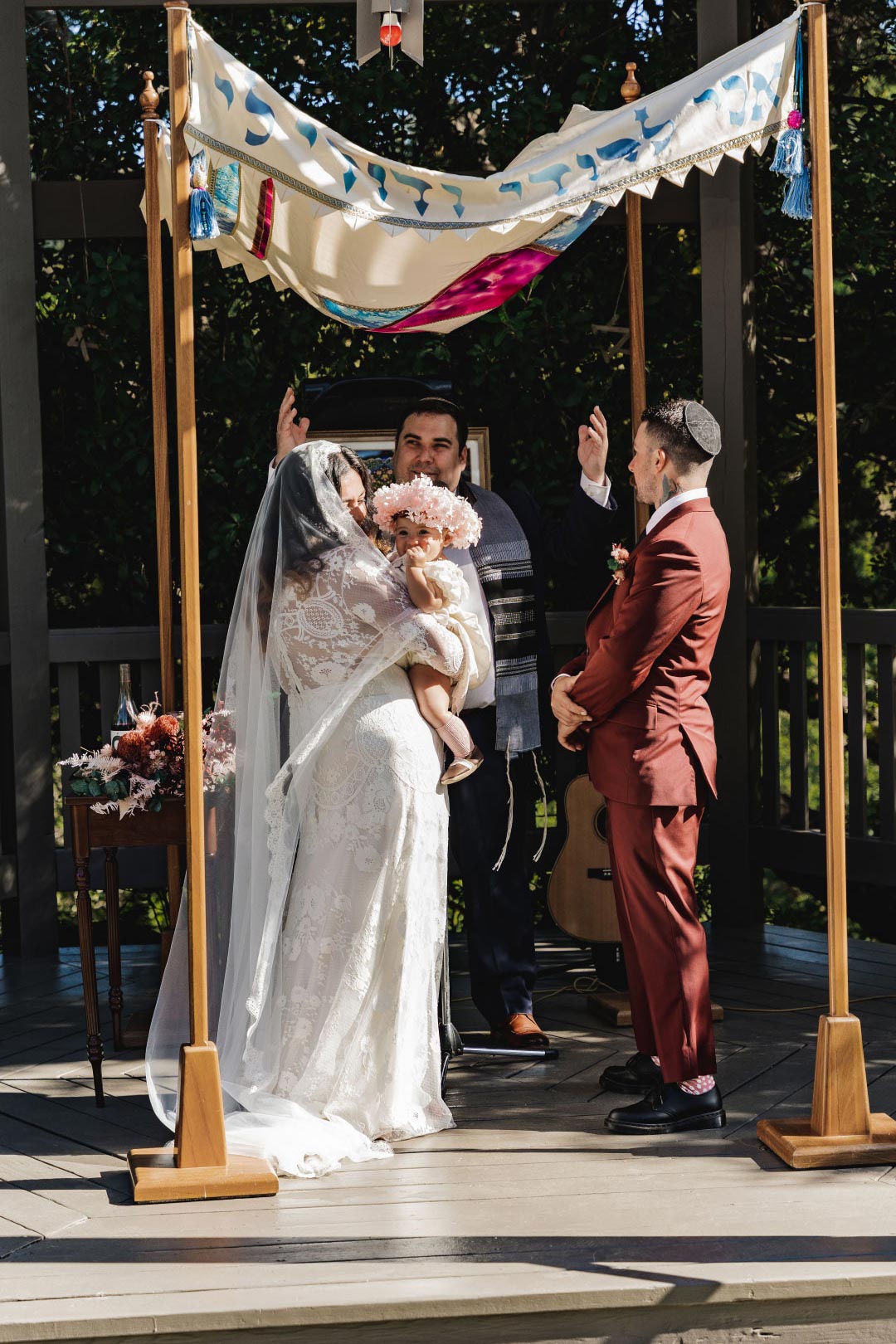 Bride Groom Baby and Rabbi exchange of wedding vows