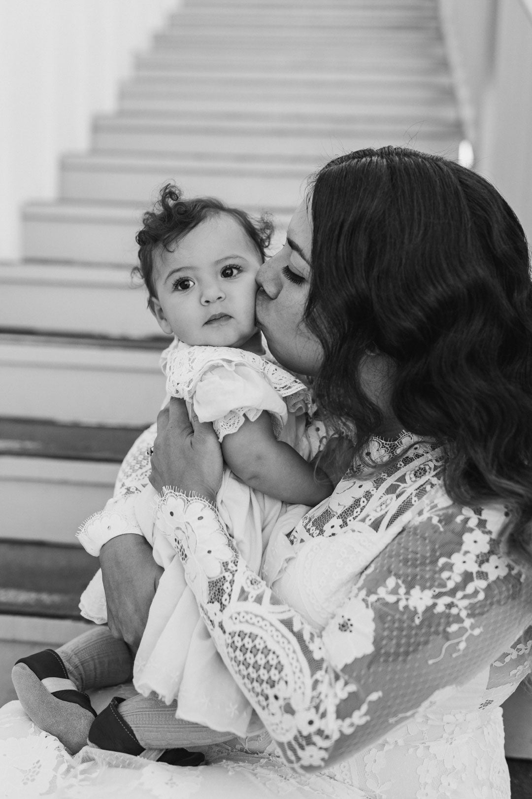 Bride kissing her baby