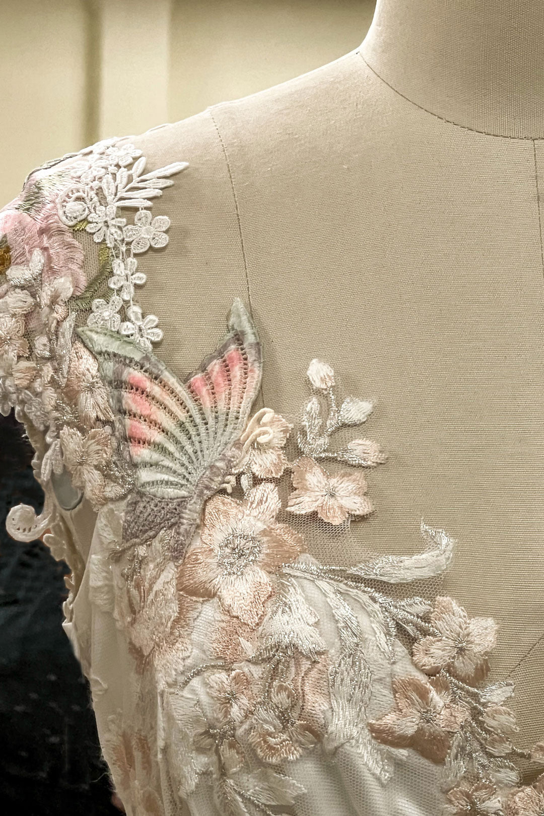 Detail of custom design lace on wedding dress by Claire Pettibone