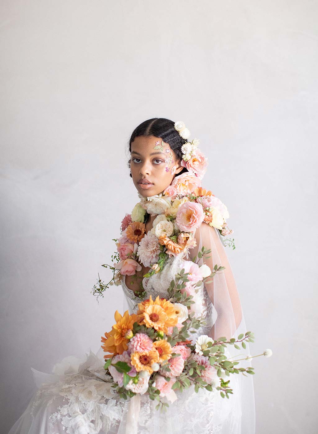 Floral display on bridal model in Claire Pettibone wedding dress Gypsy Moon