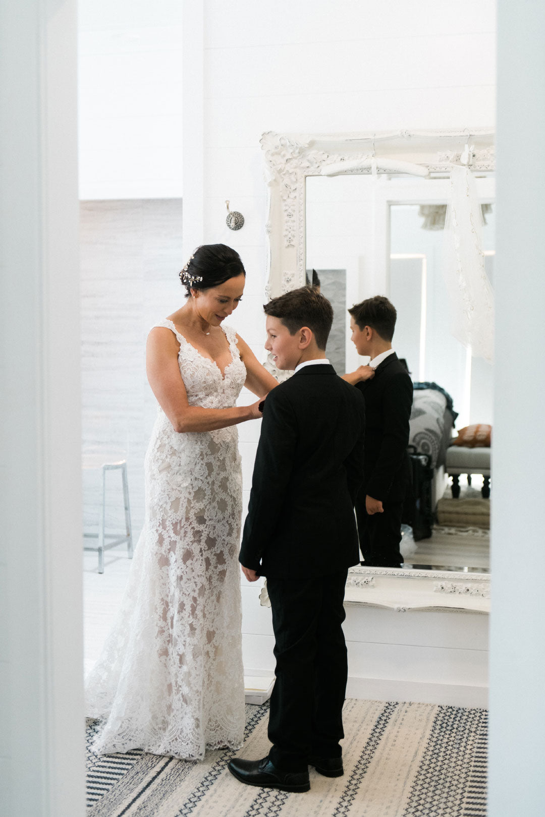 Bride in Leila by Claire Pettibone with son