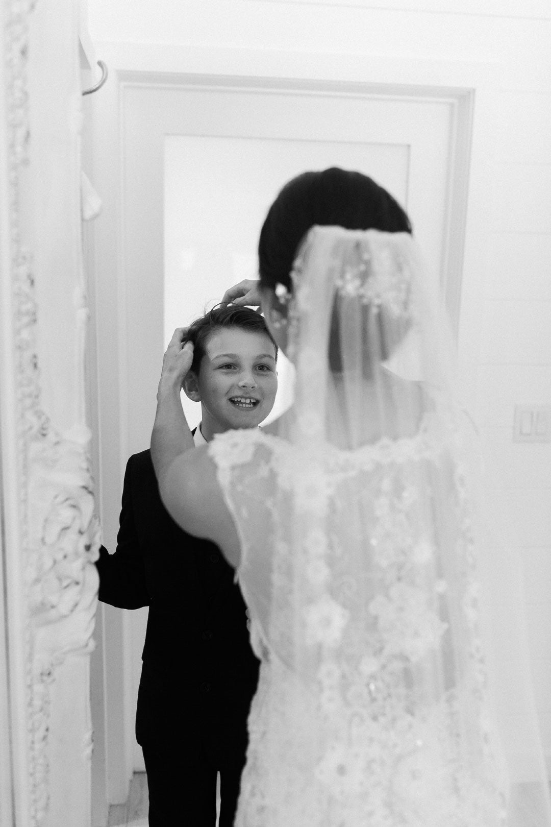 Bride in Leila by Claire Pettibone with son