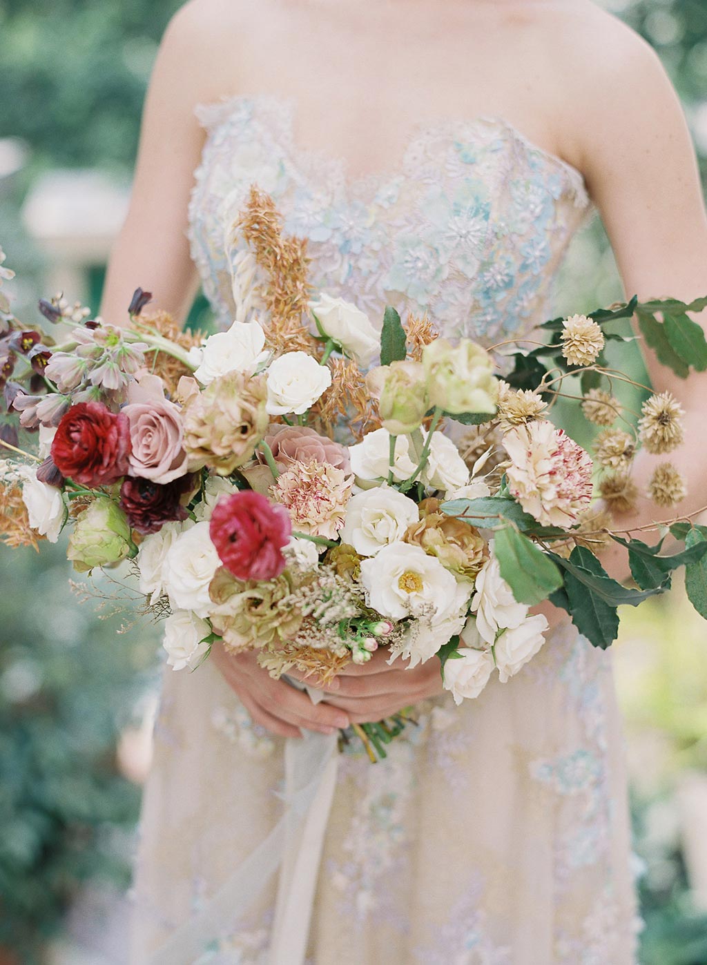 Ophelia by Claire Pettibone with wedding boquet