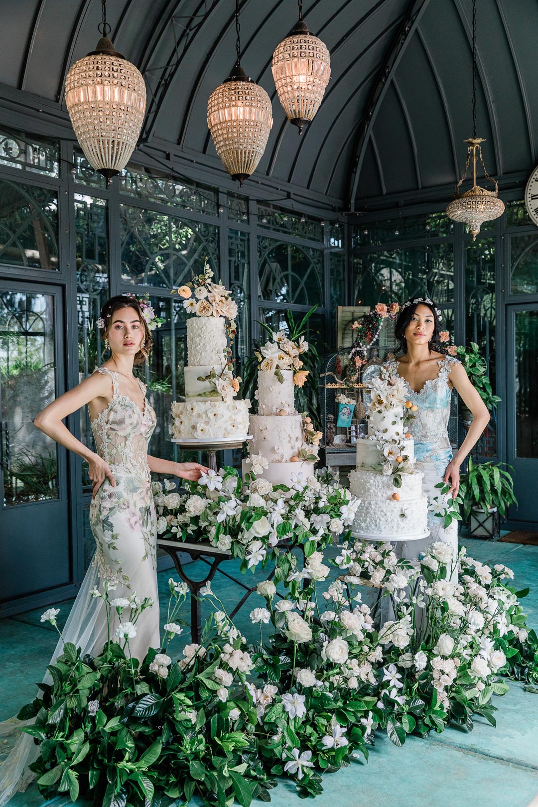 Wedding Cake and Wedding Floral Displays with models in wedding dresses