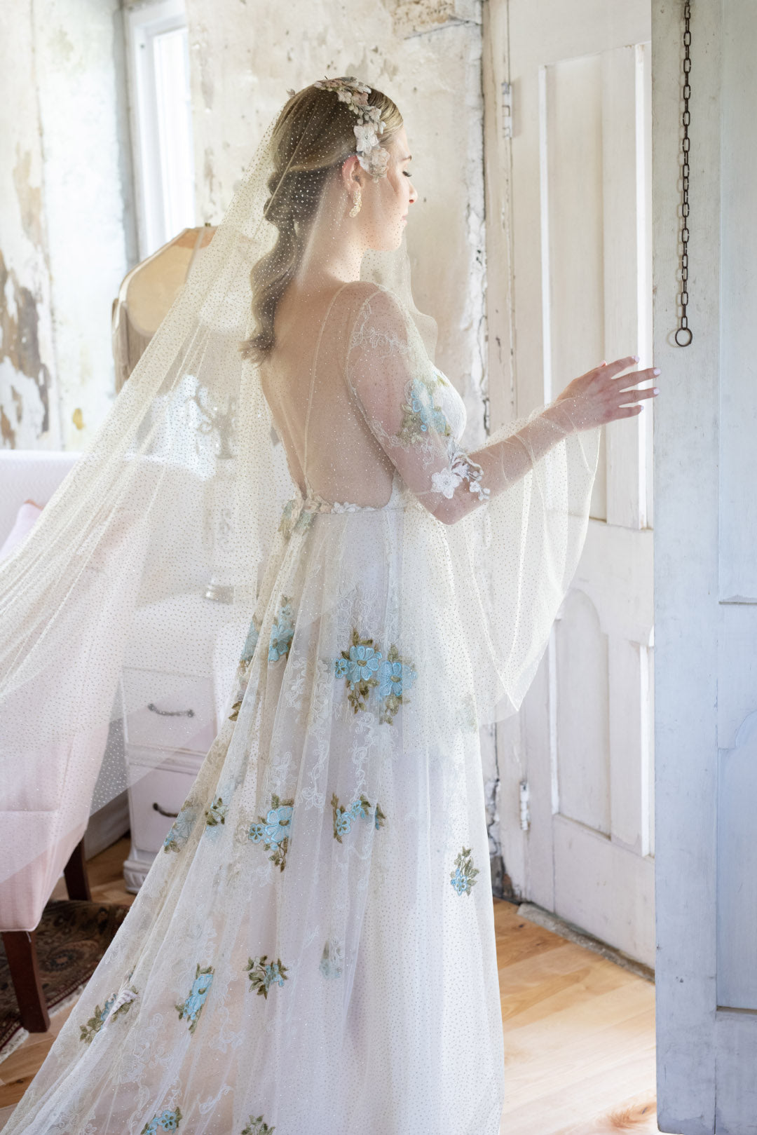 Bride wearing Chrysalis wedding dress with bell sleeves