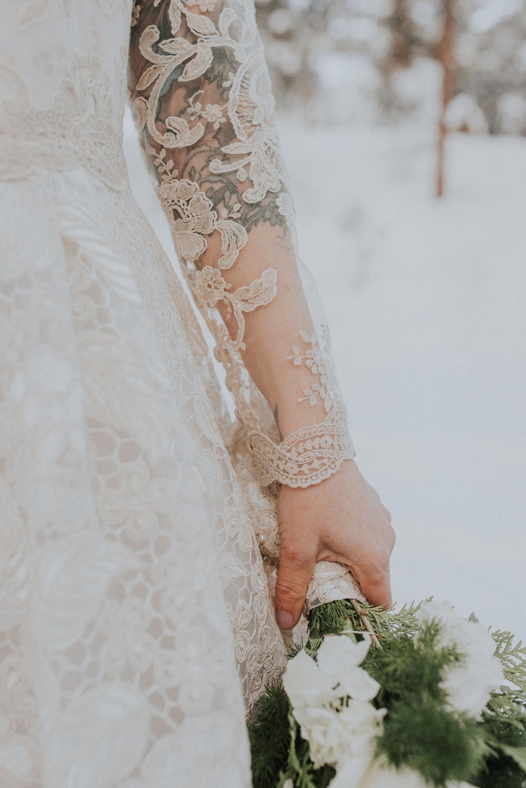 Lace sleeve detial of custom designed wedding dress by Claire Pettibone