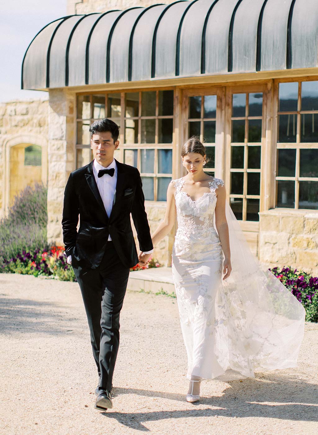 Wedding Couple Bride and Groom in Black Tuxedo and Lace Wedding Dress