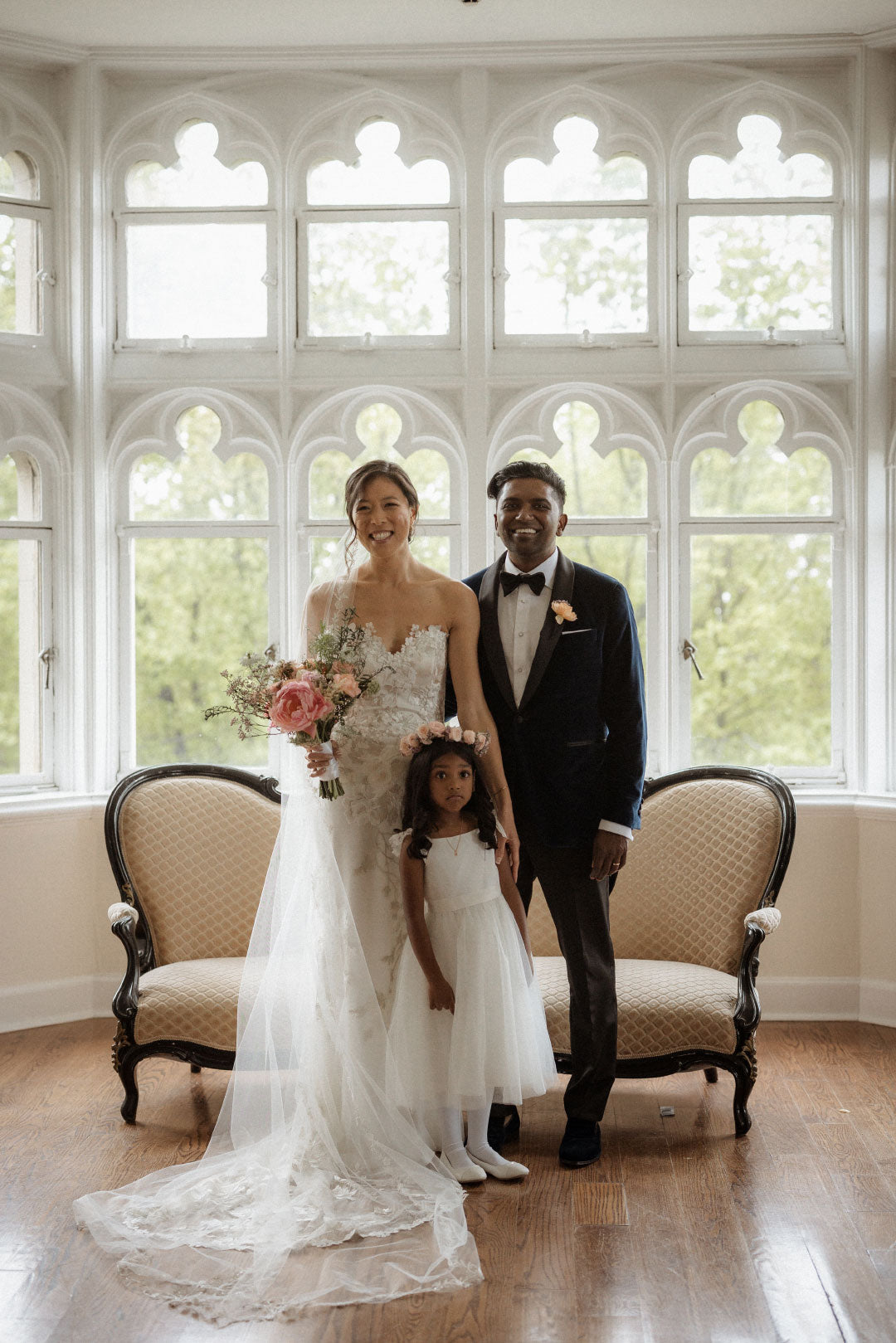 Bride and groom with flower girl