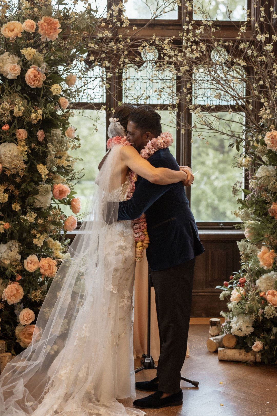 Bride and Groom hug after ceremony vows