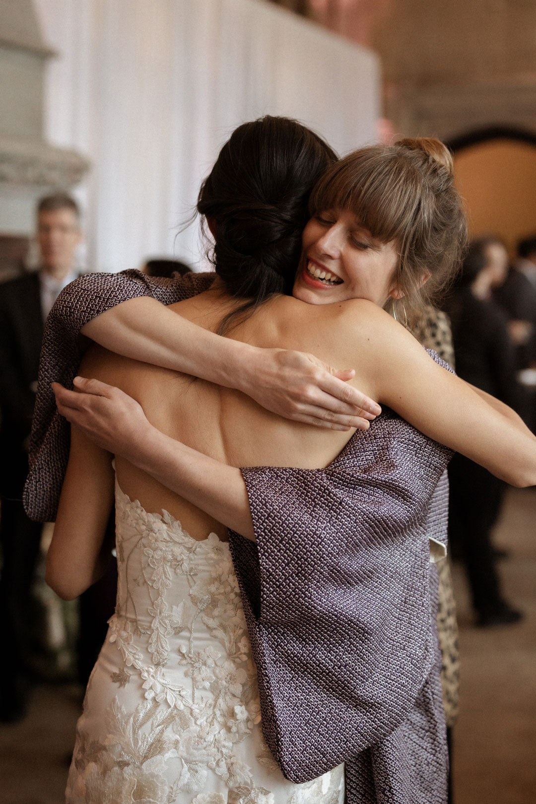 Bride hugging friends