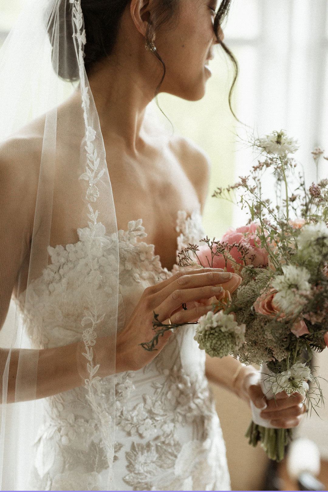 Bride holding floral boquet