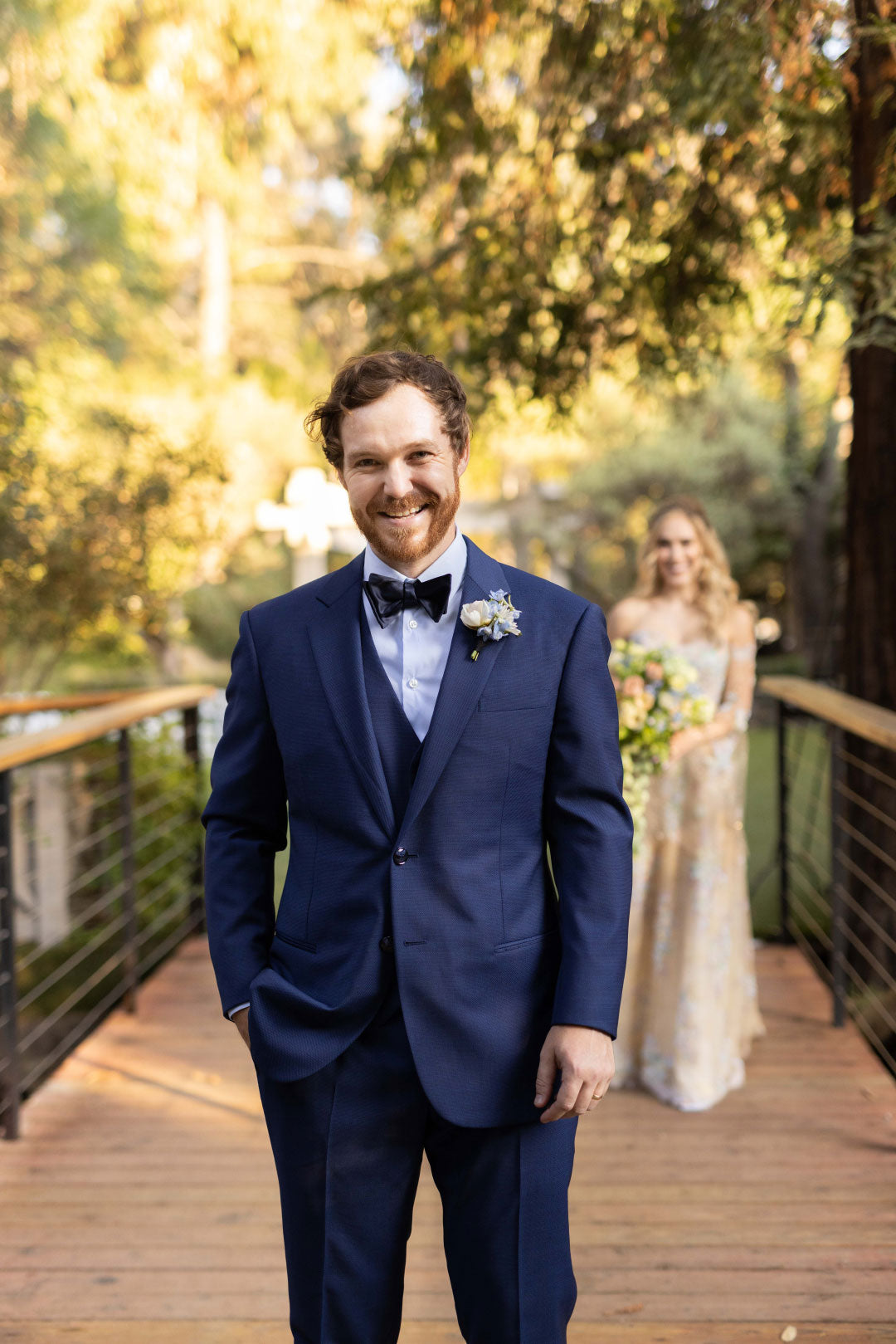 Groom in Blue Giorgio Armani Suit Bride in Background