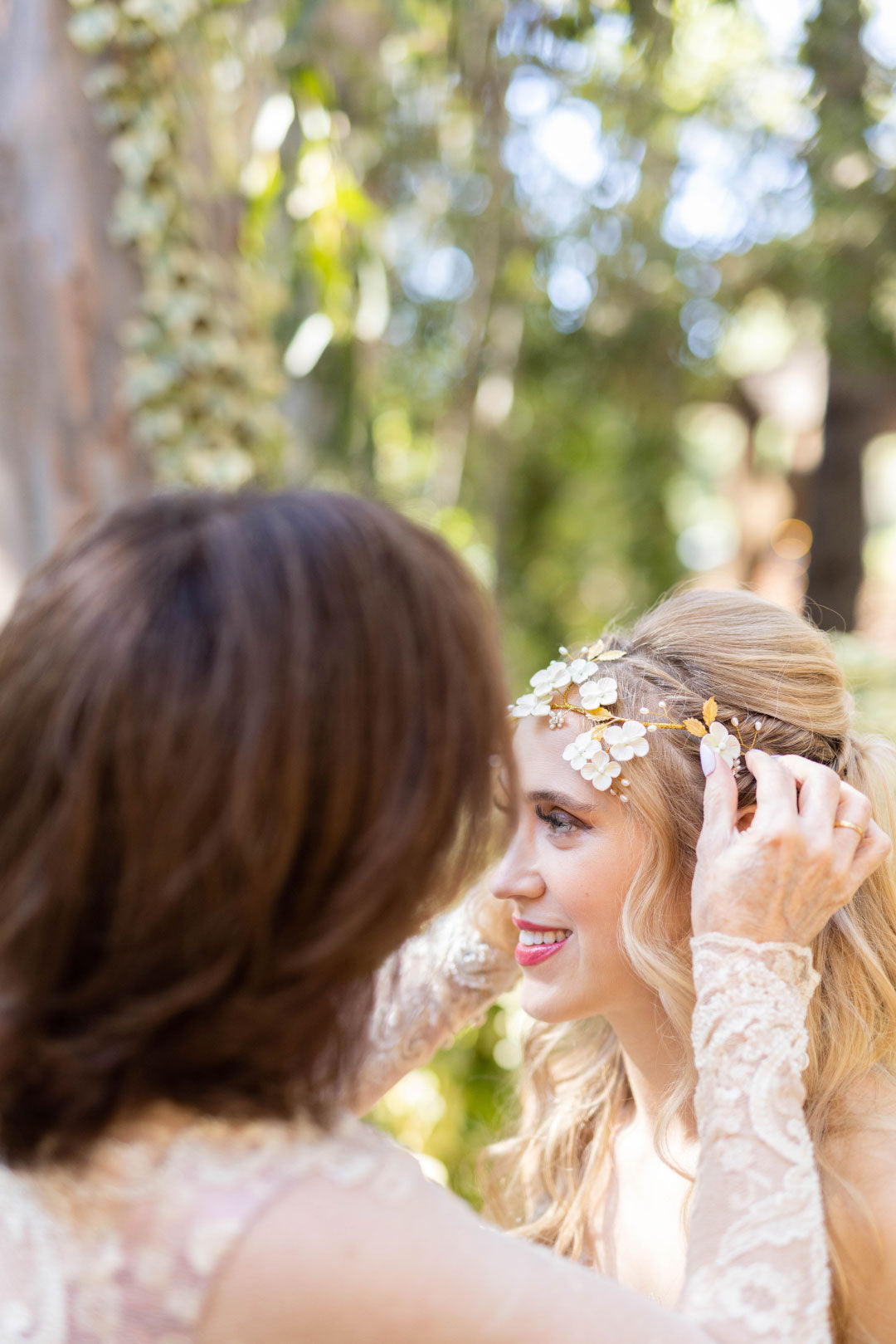 Bride having flowers fixed in hair