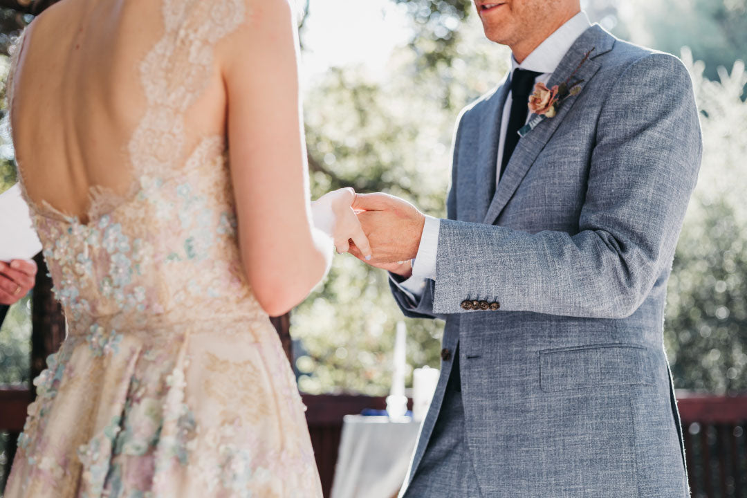 Bride and groom holding hands