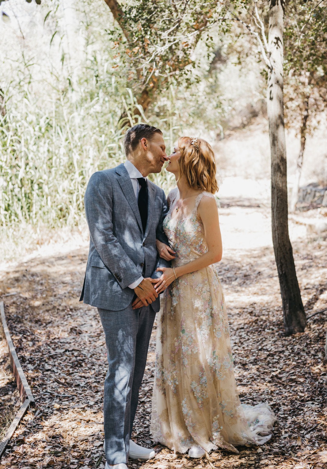 Bride and Groom Kiss Bride in Ophelia Couture Wedding Dress by Claire Pettibone