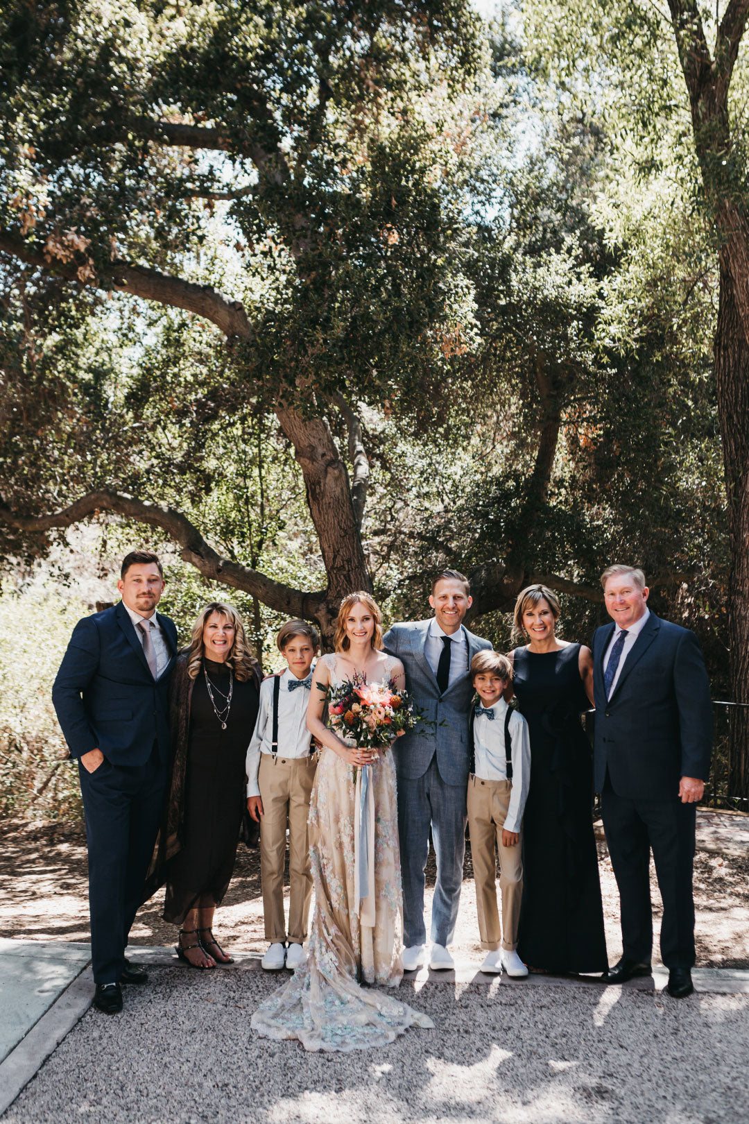 Bride and Groom with family wedding photo