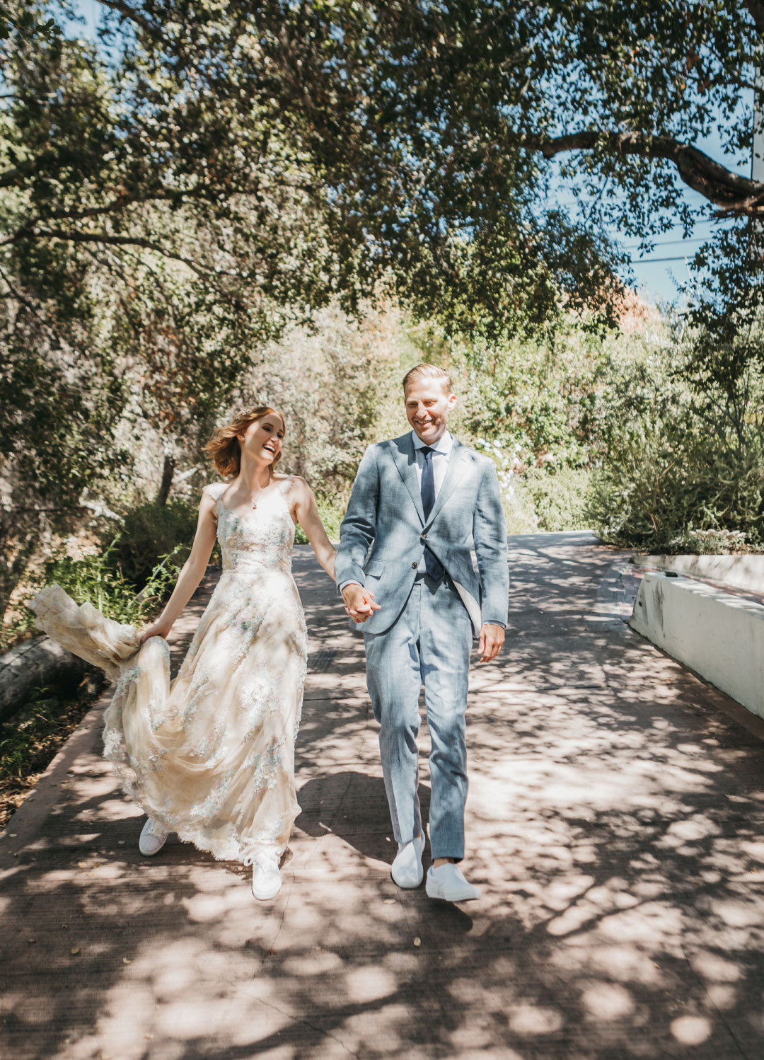 Bride and Groom walking on path