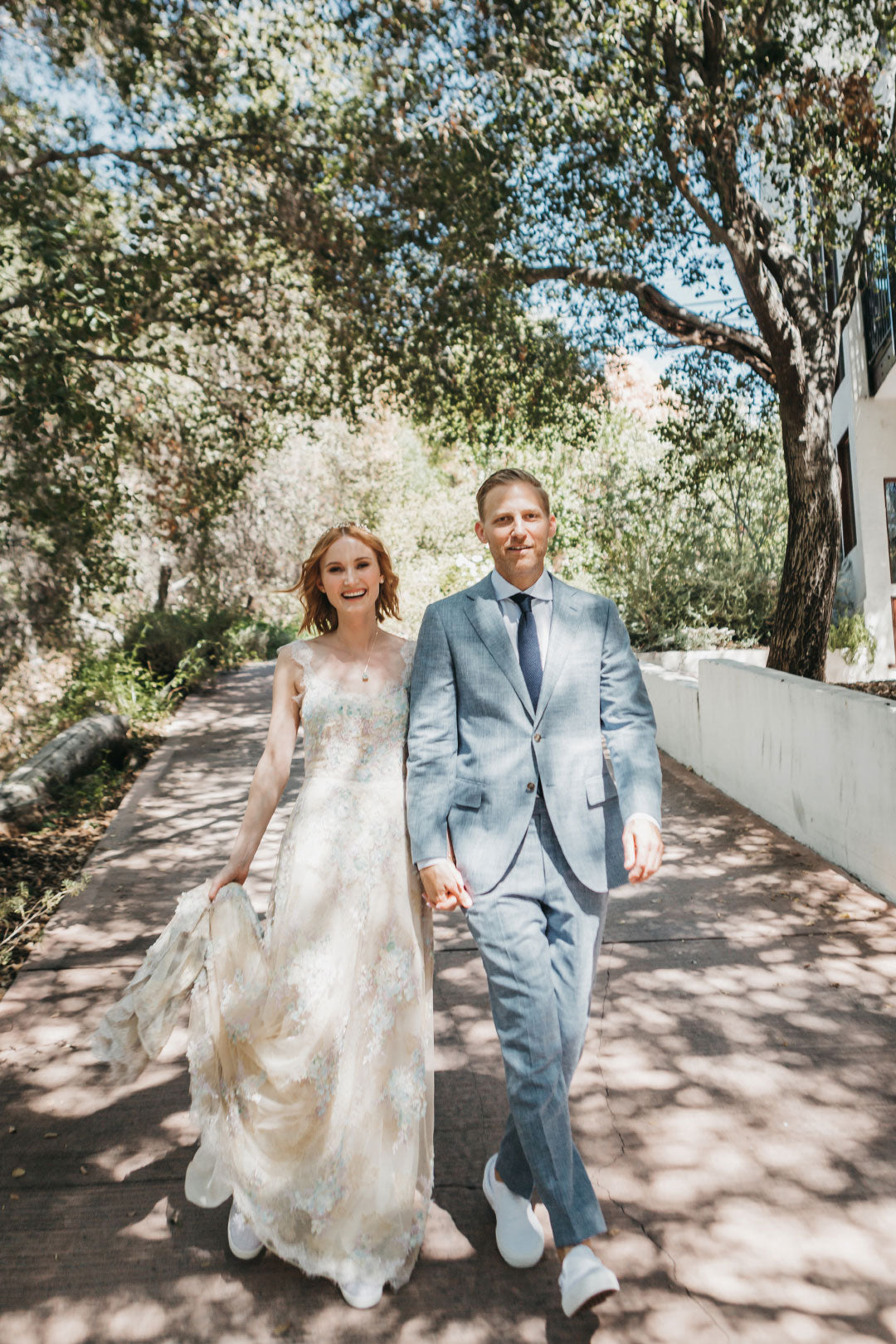 Bride and Groom walking on path