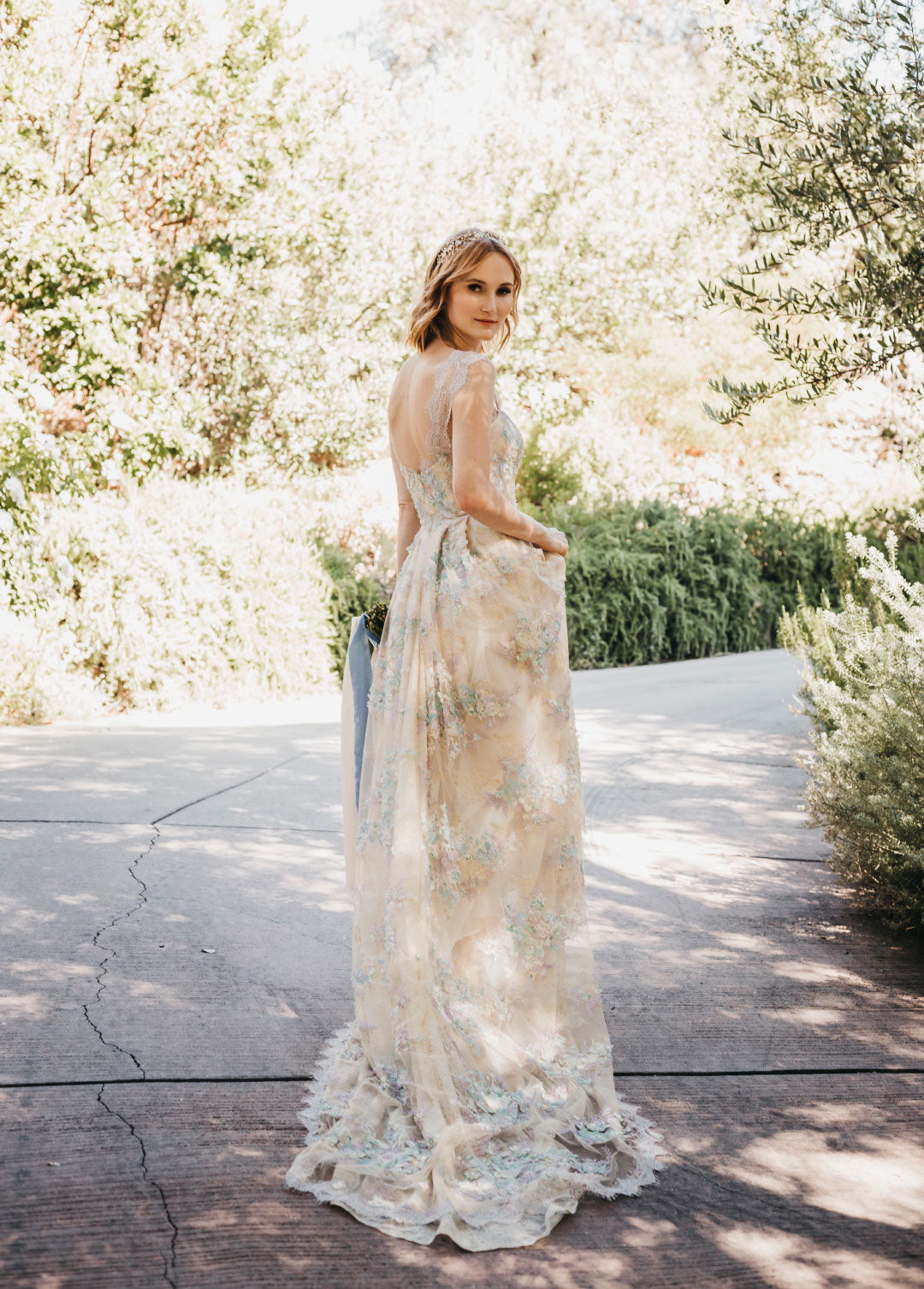 Bride in Ophelia colorful wedding dress by Claire Pettibone