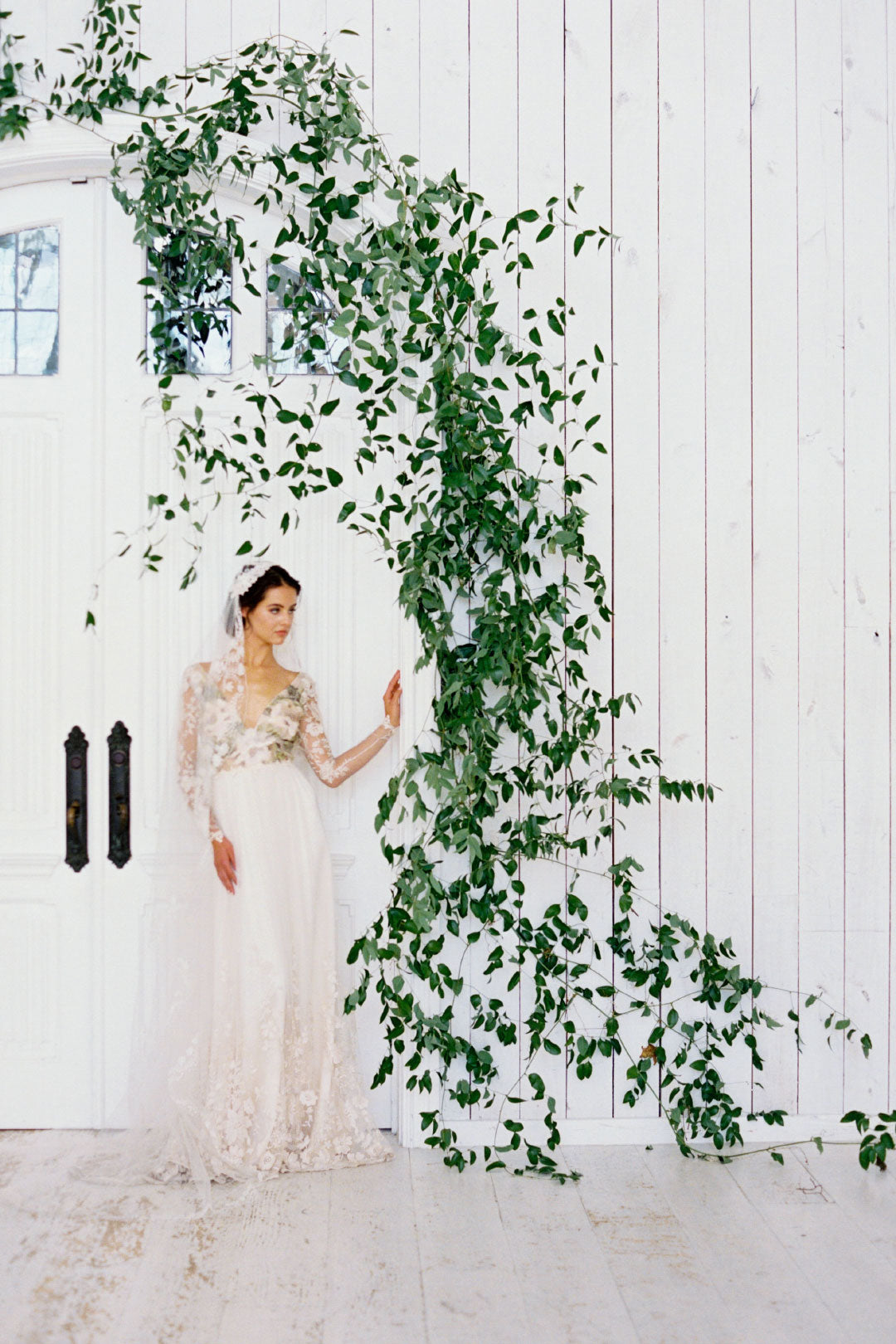 Bride near floral arch