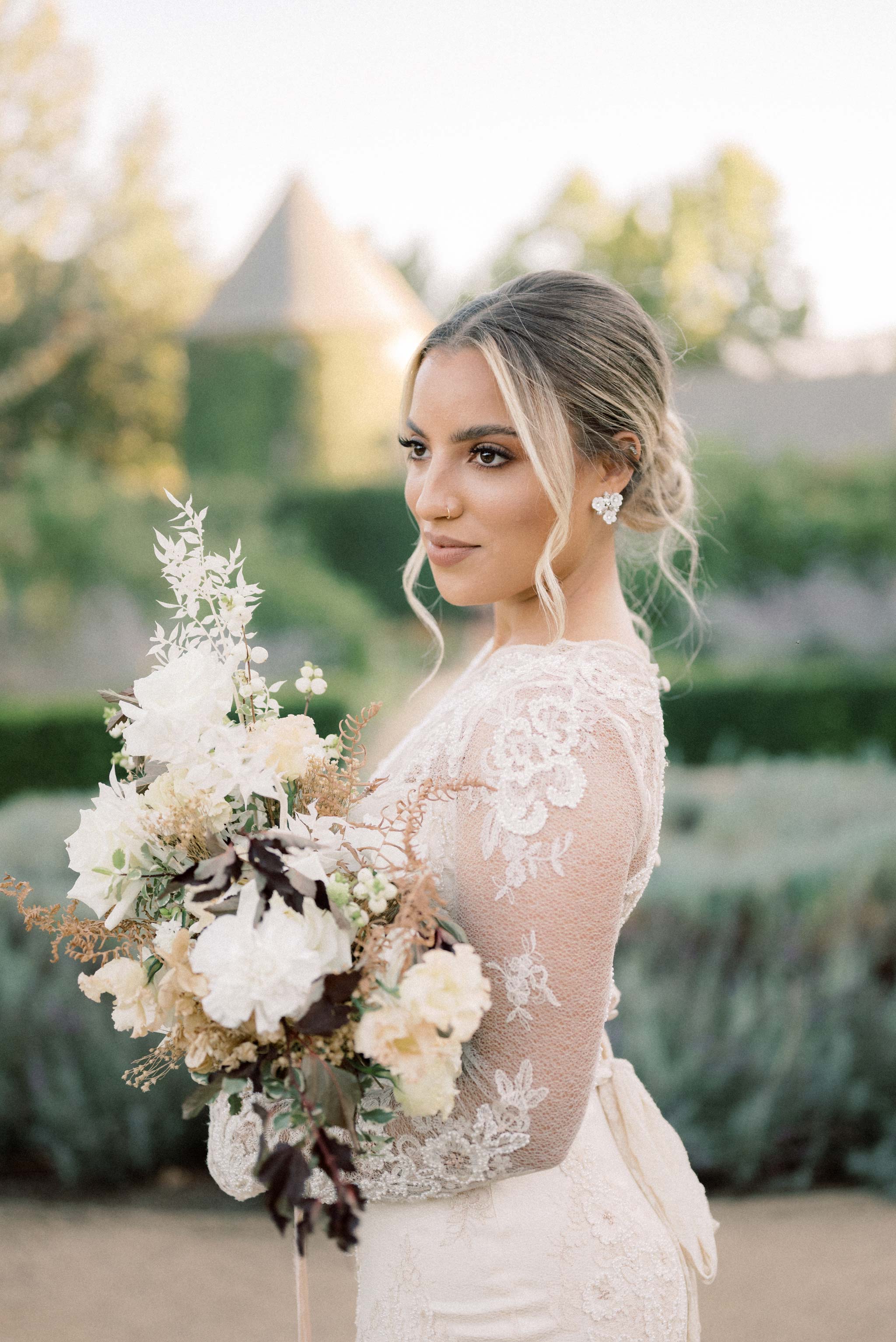 Floral wedding bouquet Sleeve detail of Pearle Couture Wedding Dress