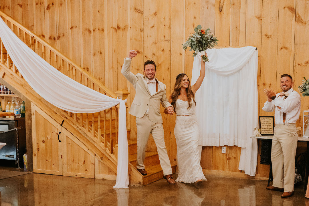 Bride and groom entering the wedding party