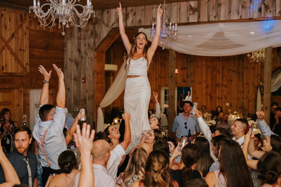 Bride lifted and celebrated