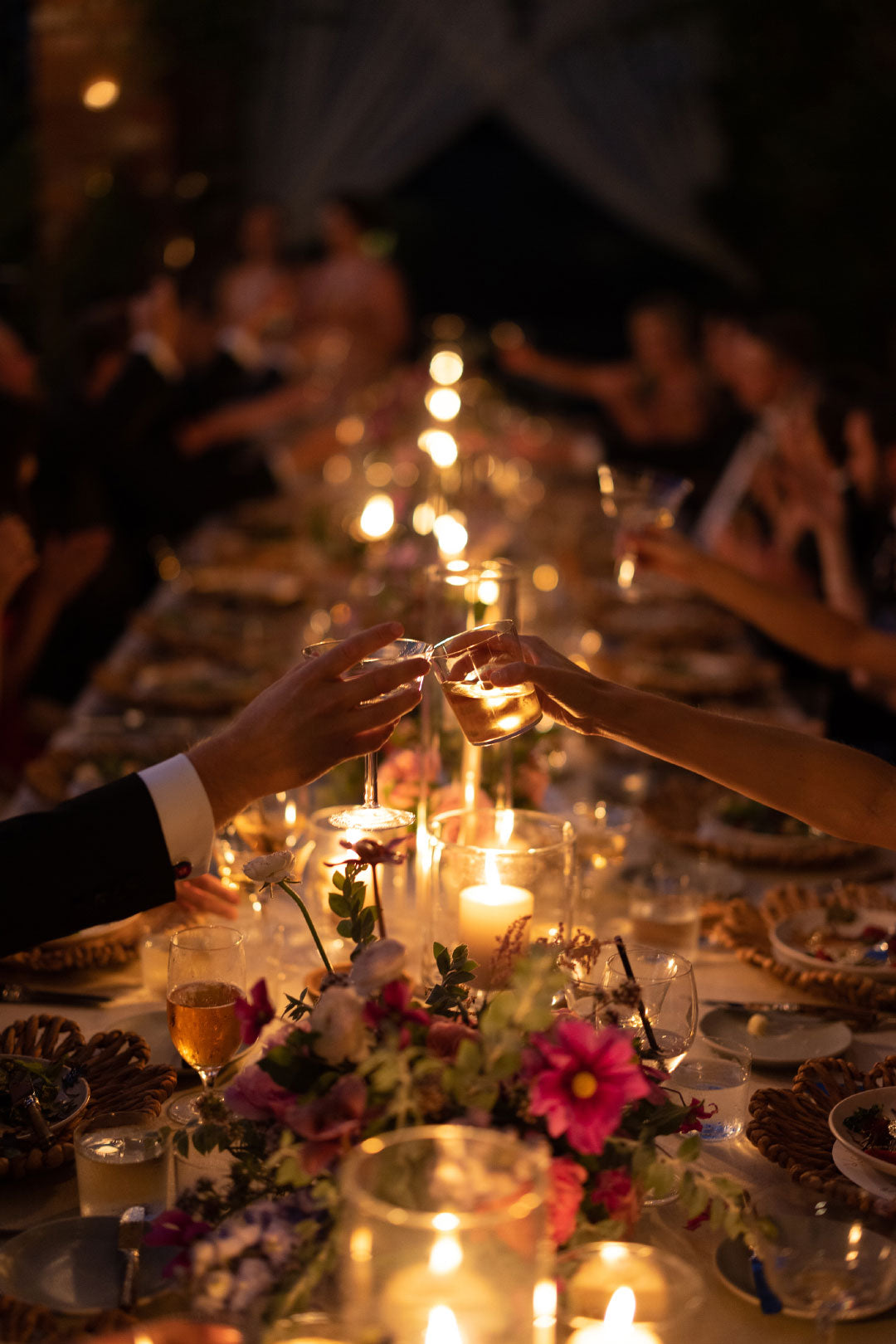 Bride and groom toasting at wedding dinner