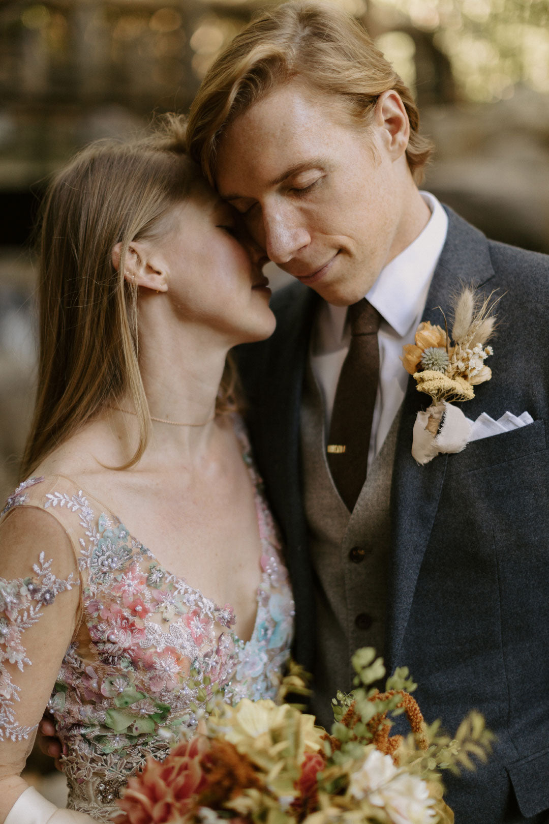 Bride and Groom embrace in wedding photo Santorini Colorful wedding dress