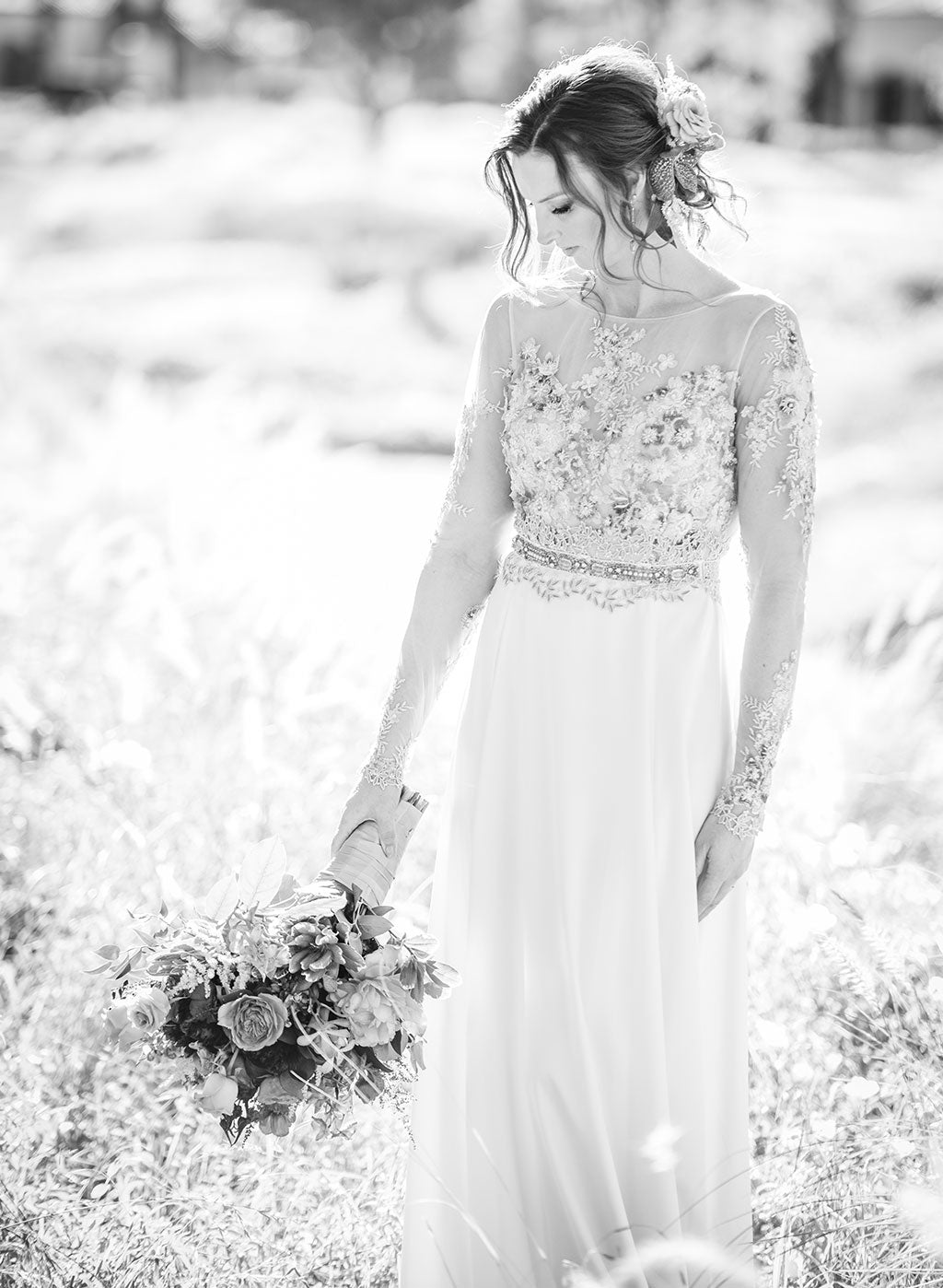 Black and white picture of bride in weddding dress 