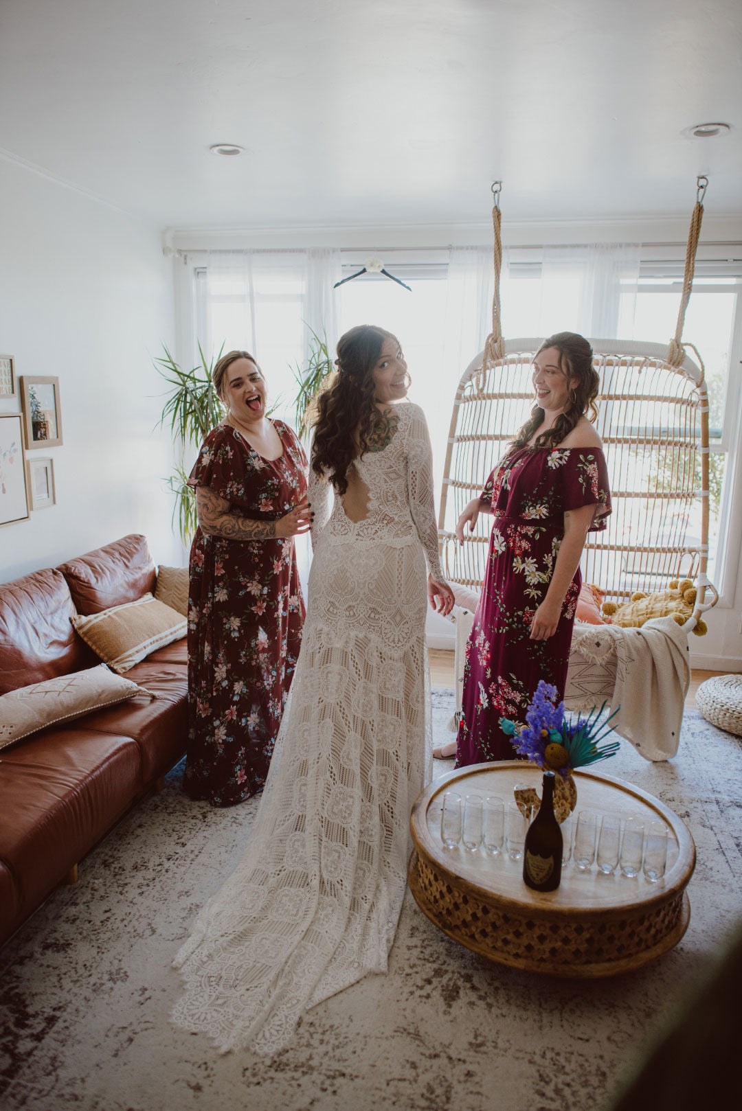 Bride dressing for wedding in Shenandoah wedding dress