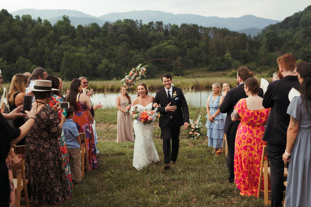 Bride and Groom walking the aisle after vows